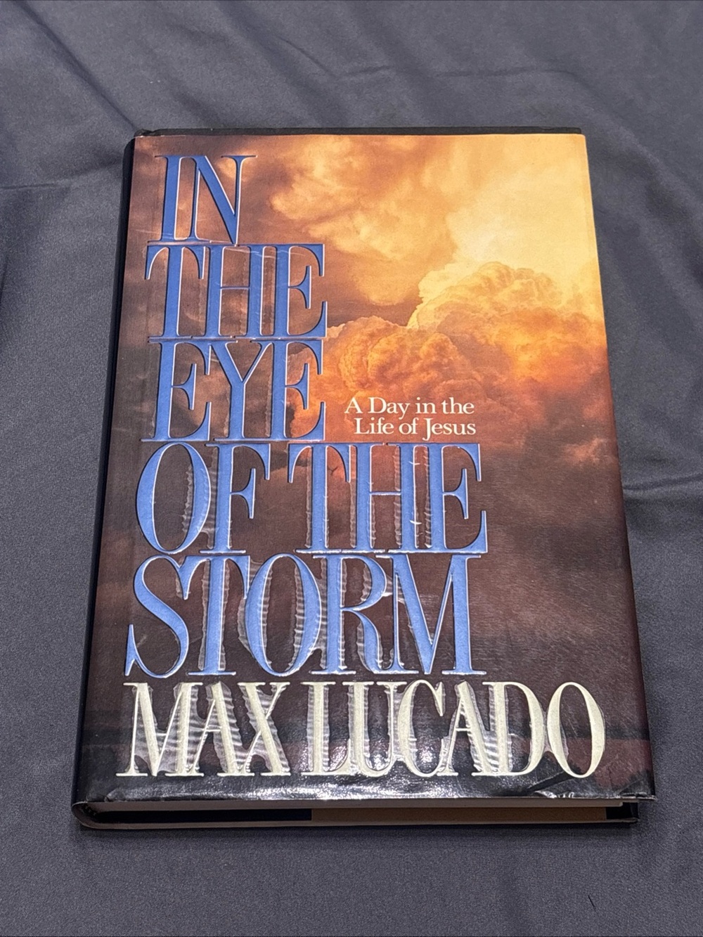 In the Eye of the Storm by Max Lucado - Brown/Orange Hardcover Coffee Table Book